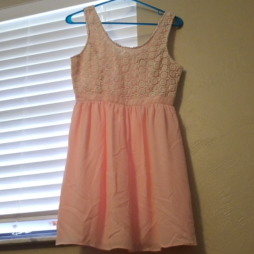 Pink and white summer dress with a flowered top